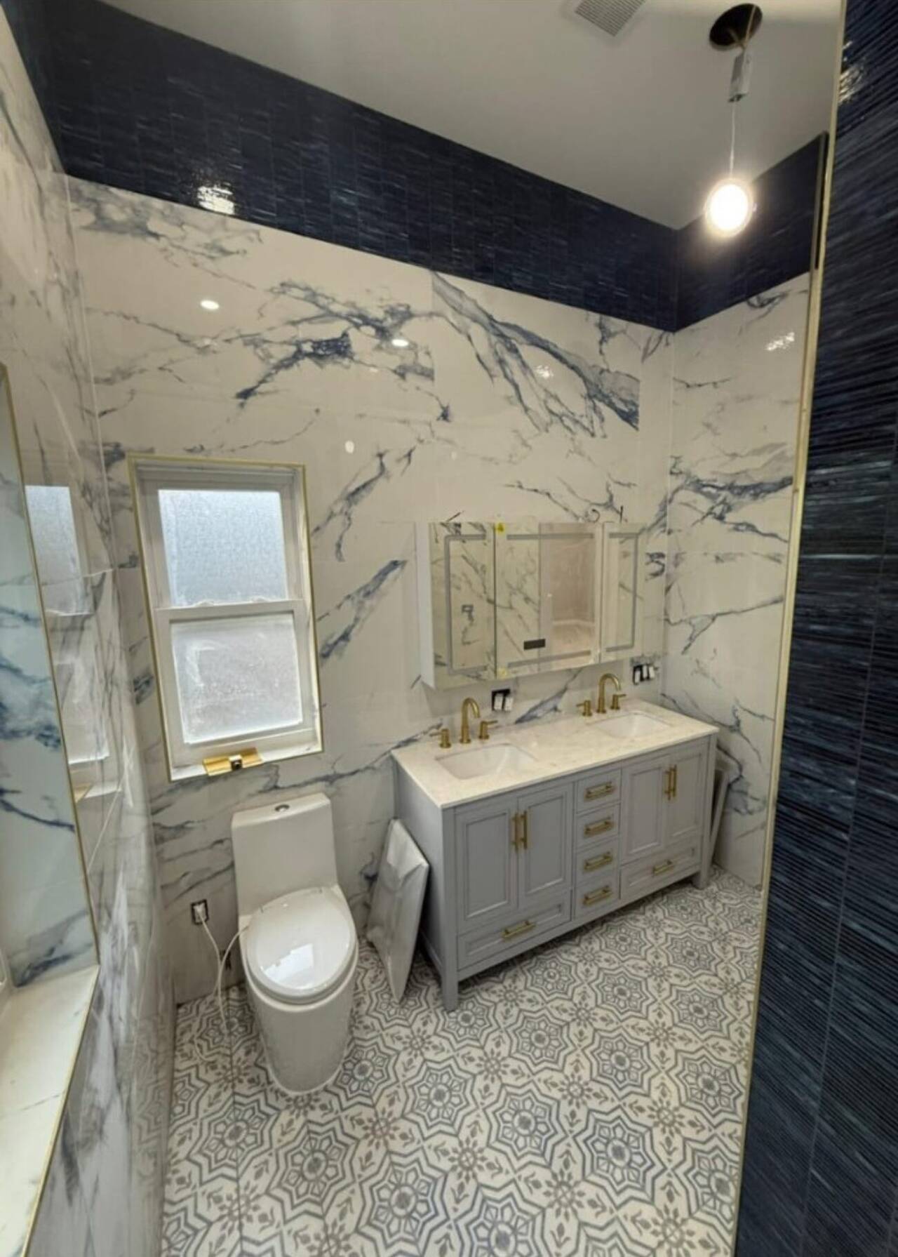Luxury marble bathroom with patterned tile floor